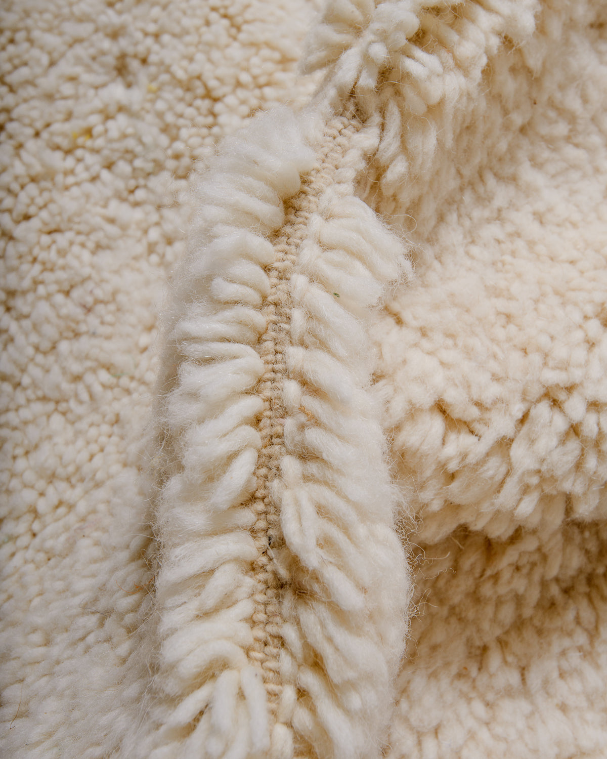 Detail of wool Berber rug showing density of pile.